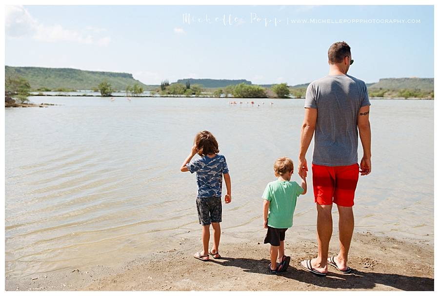 man and two sons at the beach