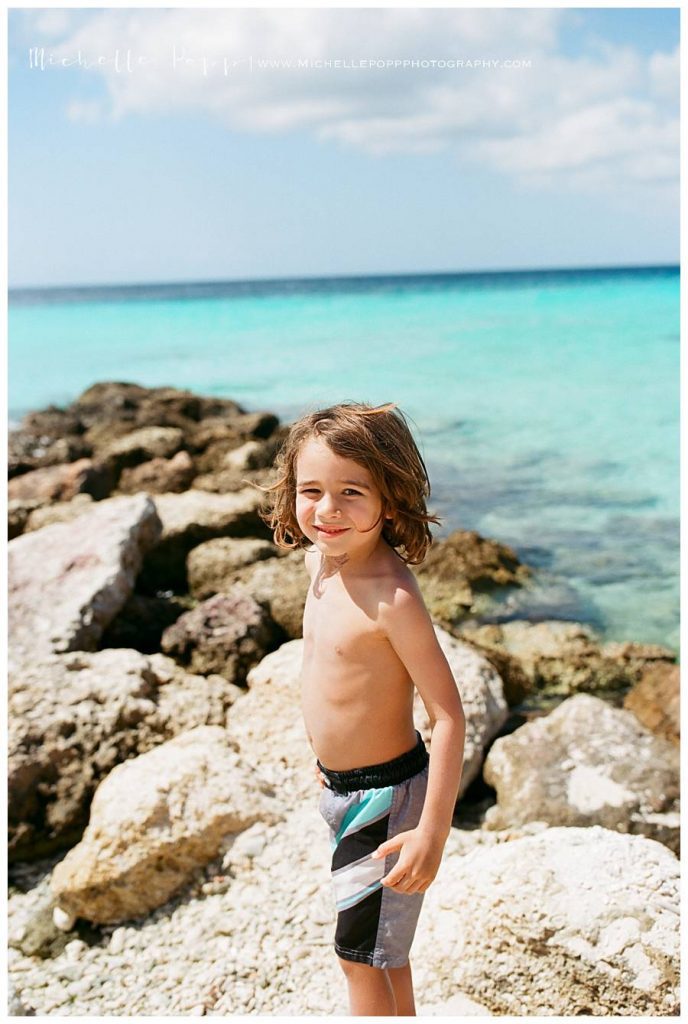 boy looking back at camera at the beach