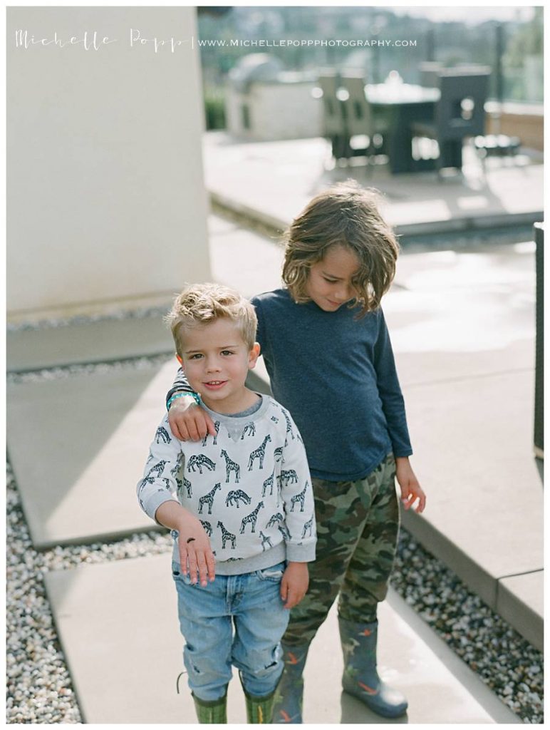 boys in backyard hugging