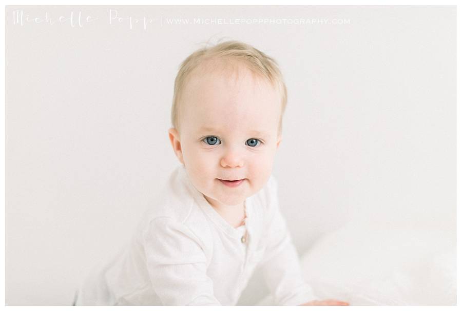 TODDLER BOY LOOKING AT CAMERA