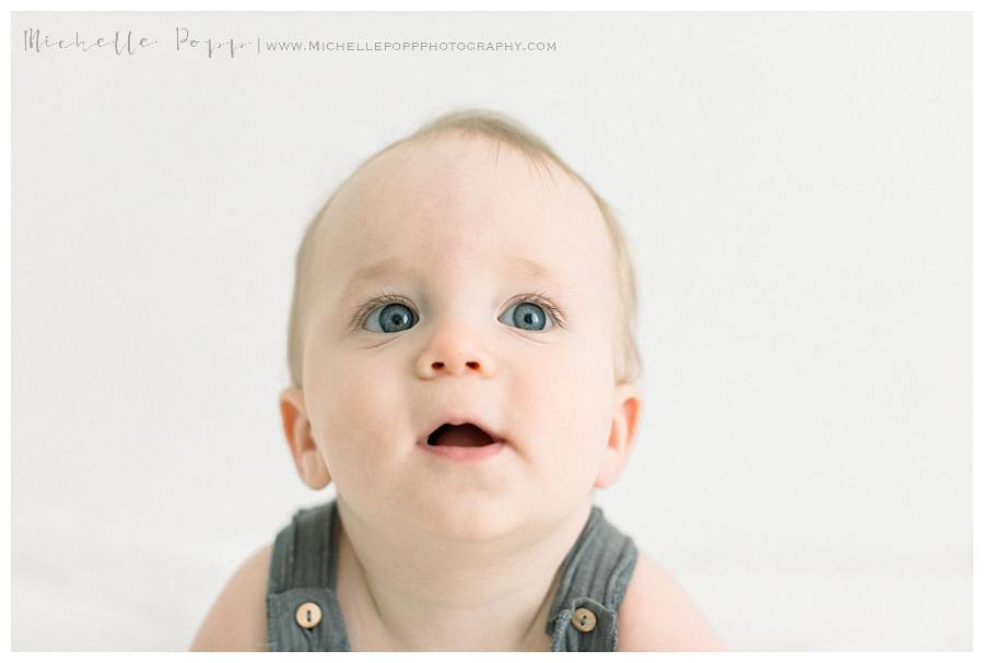 toddler boy looking up at camera