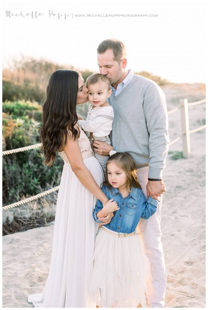 family of four at the beach