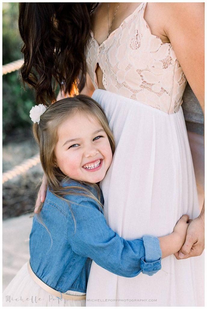 toddler girl smiling at the camera