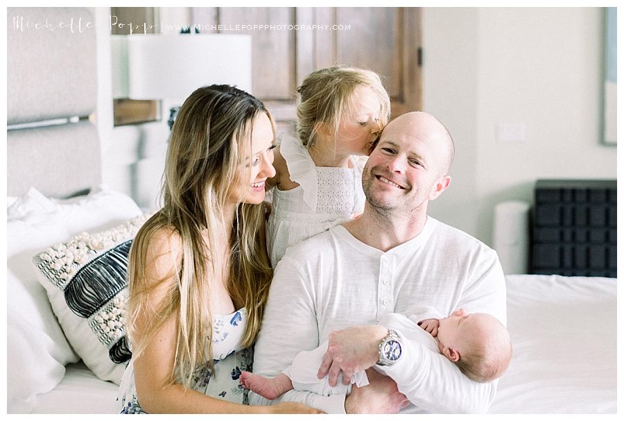 family of four dad smiling