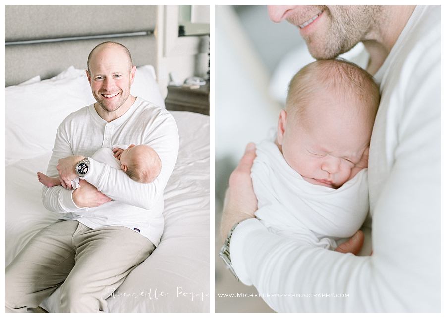 dad holding newborn baby