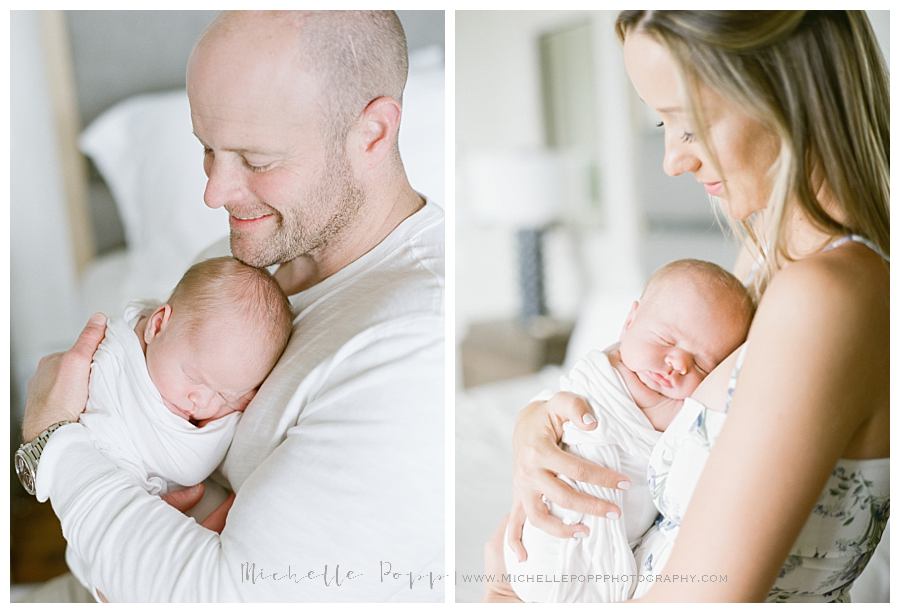 dad and mom holding baby