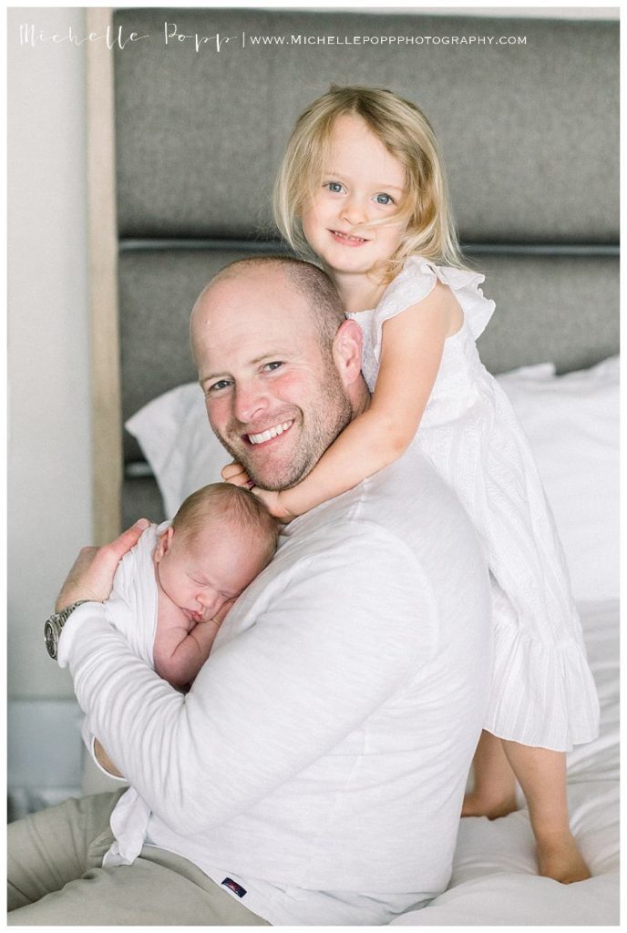 dad and daughter smiling