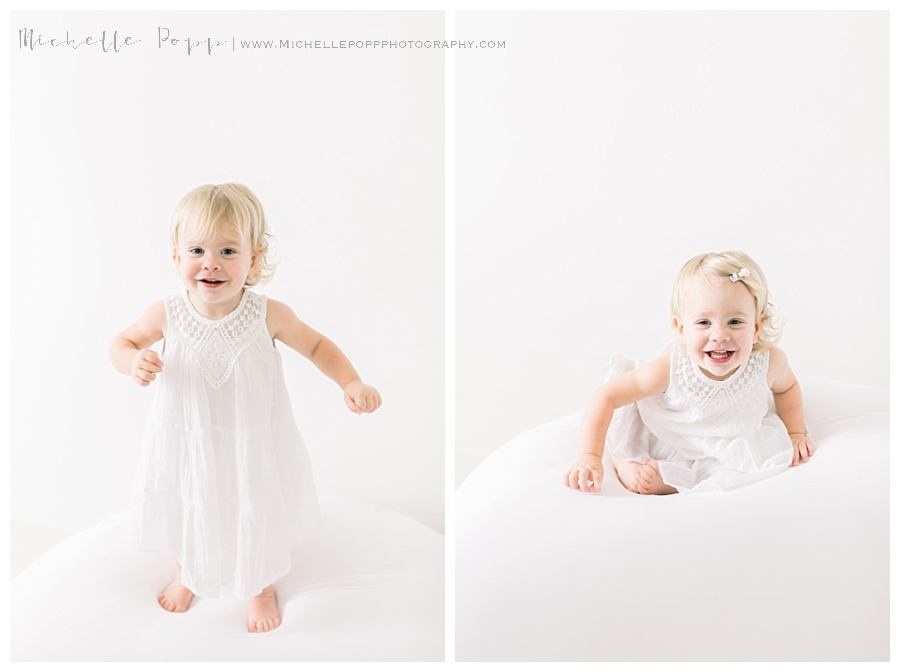 little girl jumping on bed