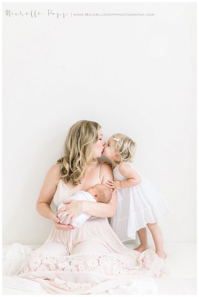 mom and daughter nuzzling noses