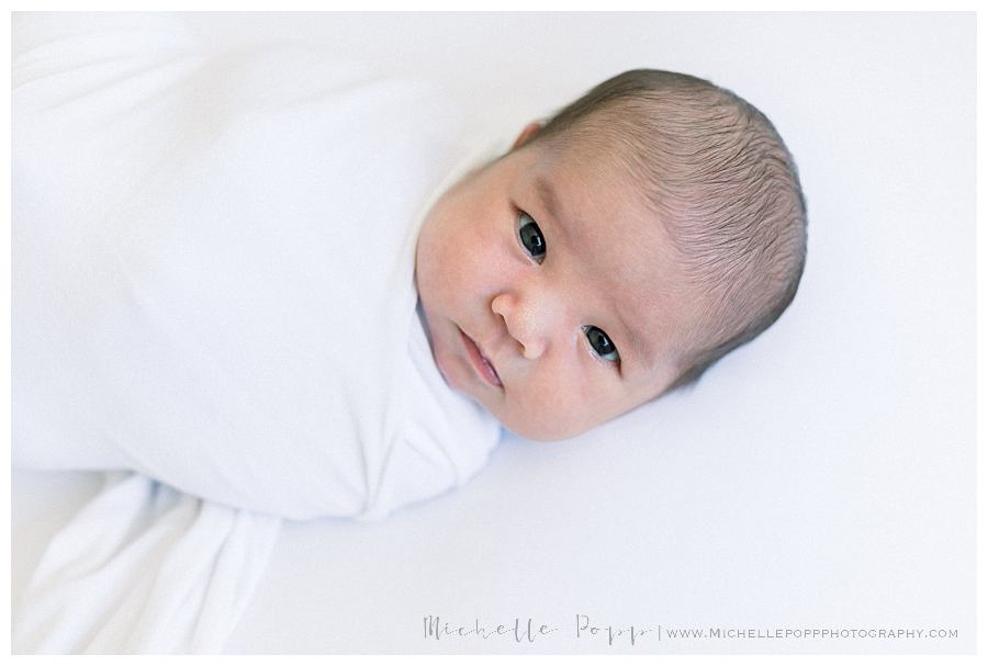 newborn baby in swaddle