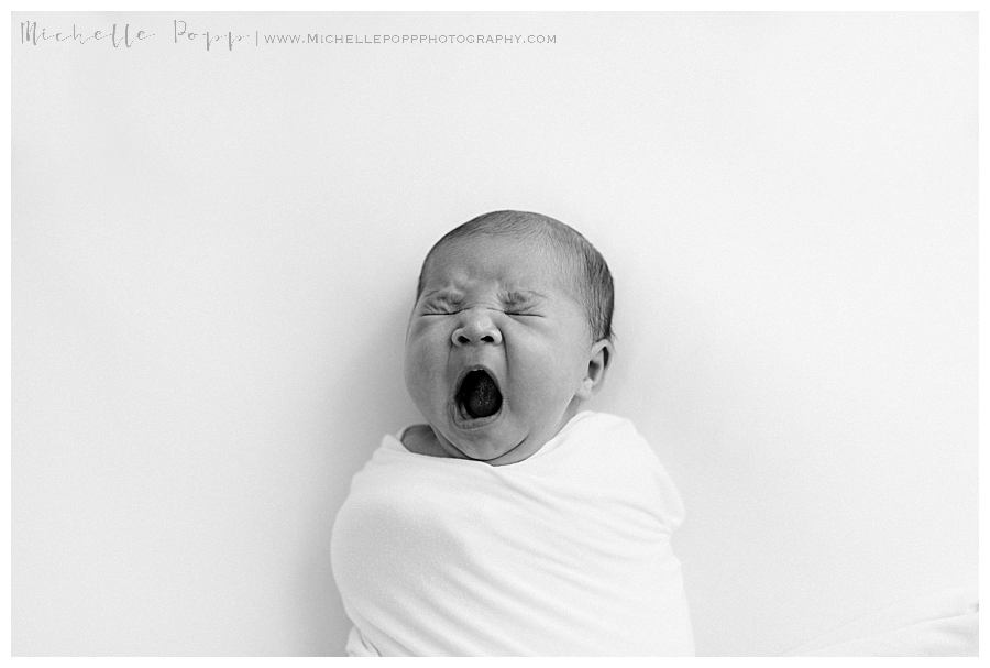 newborn baby yawning