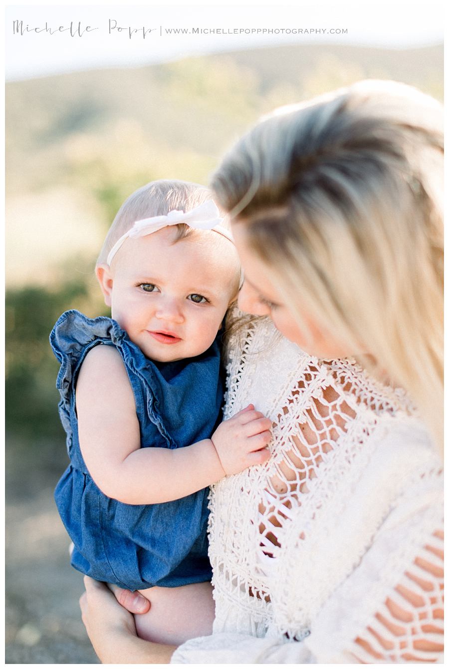 baby girl in blue romper