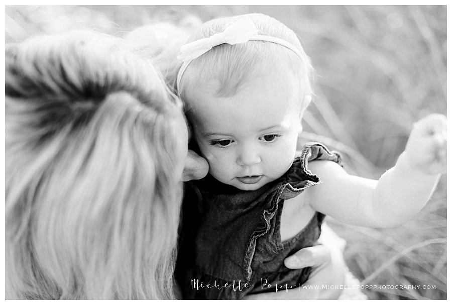 mom snuggling baby girl