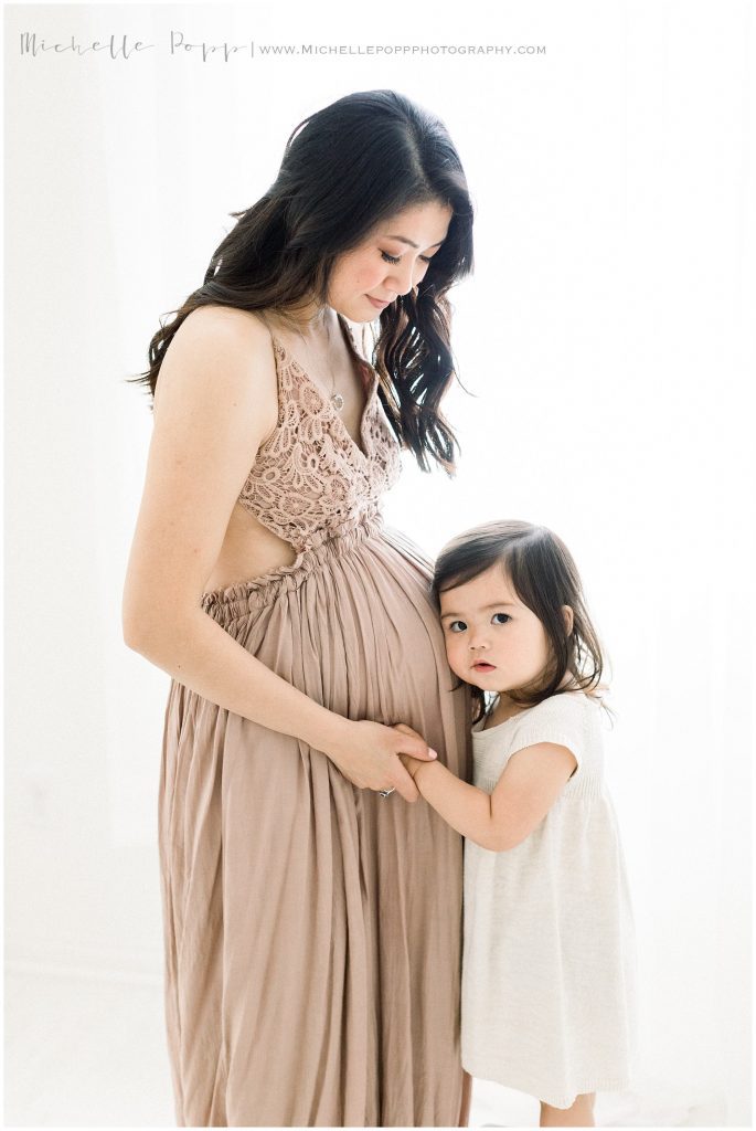 pregnant mom in beige dress