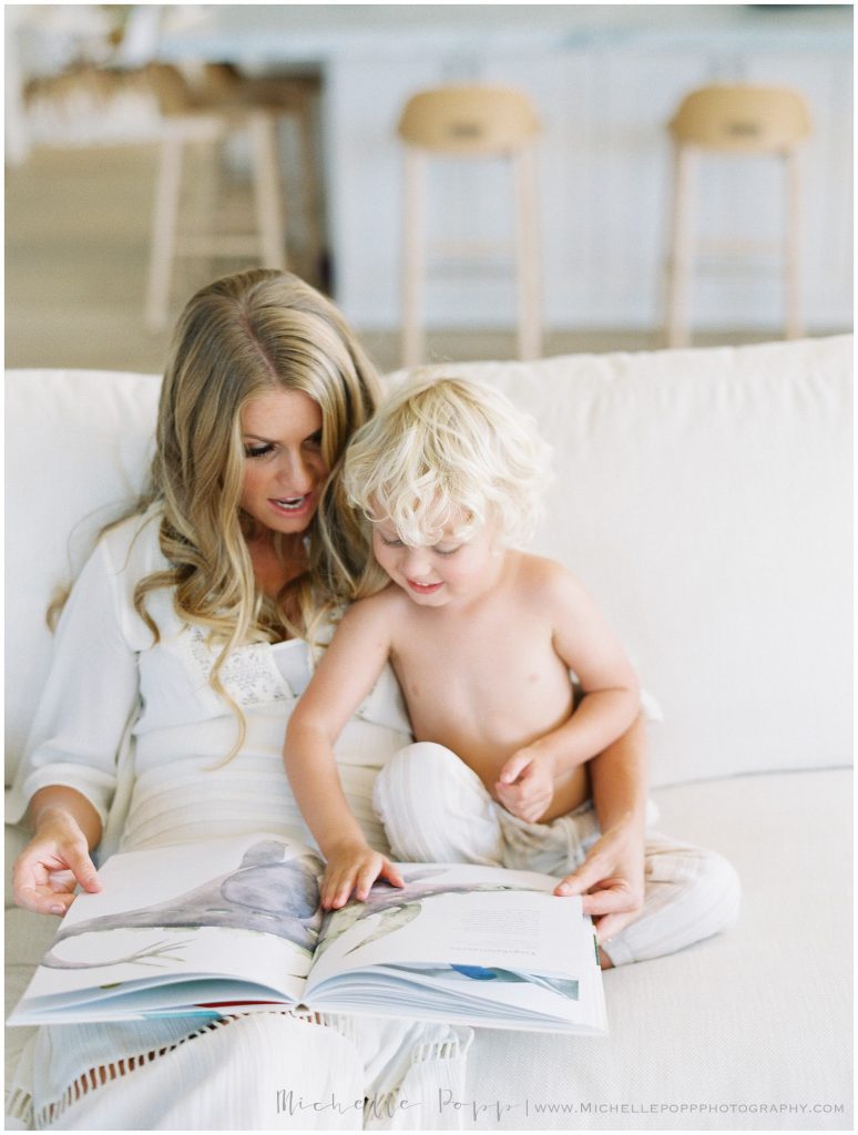 mom and son reading a book together