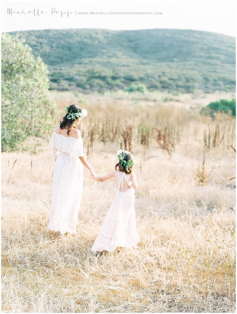 mom and daughter in matching flower crowns