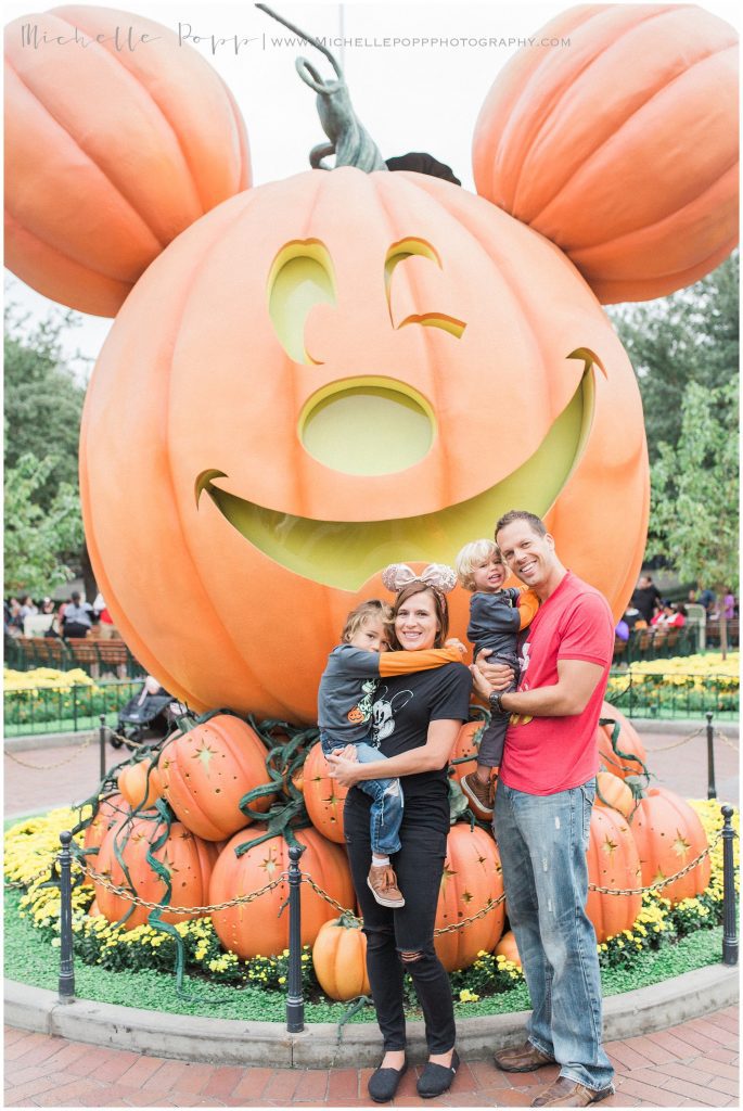 family at disneyland during halloween