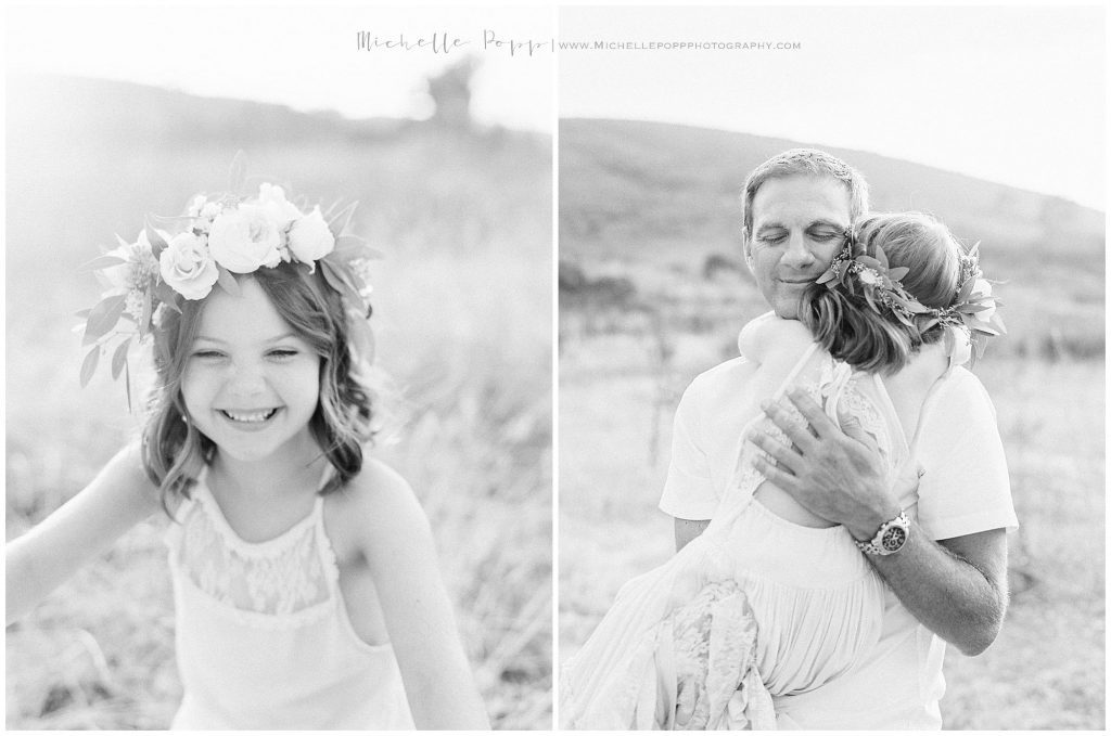 dad and daughter hugging in a field