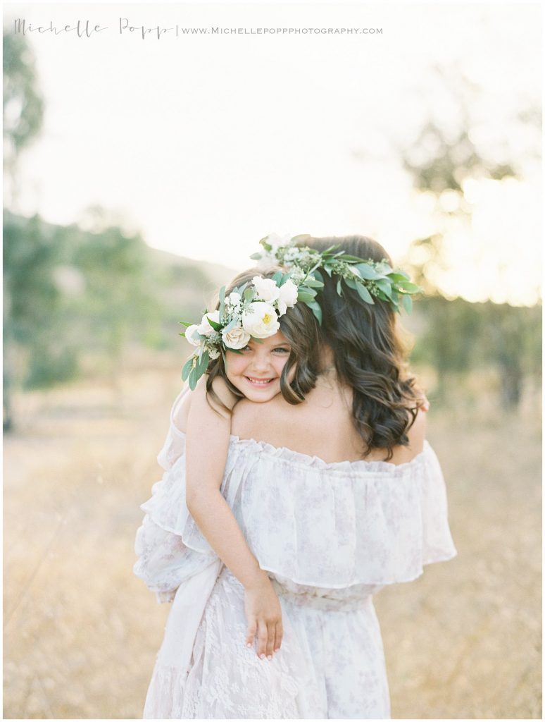 mom and daughter hugging each other