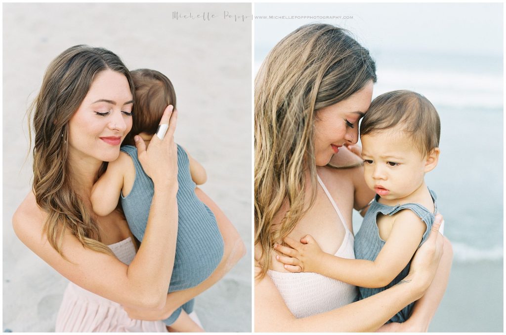 mom giving little boy hugs on the beach