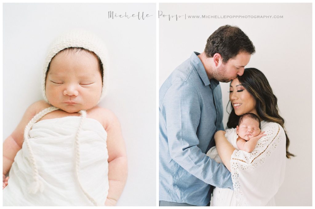 dad kissing mom on forehead with newborn in arms