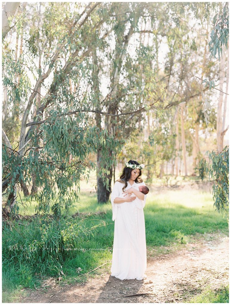 Outdoor newborn photography in field