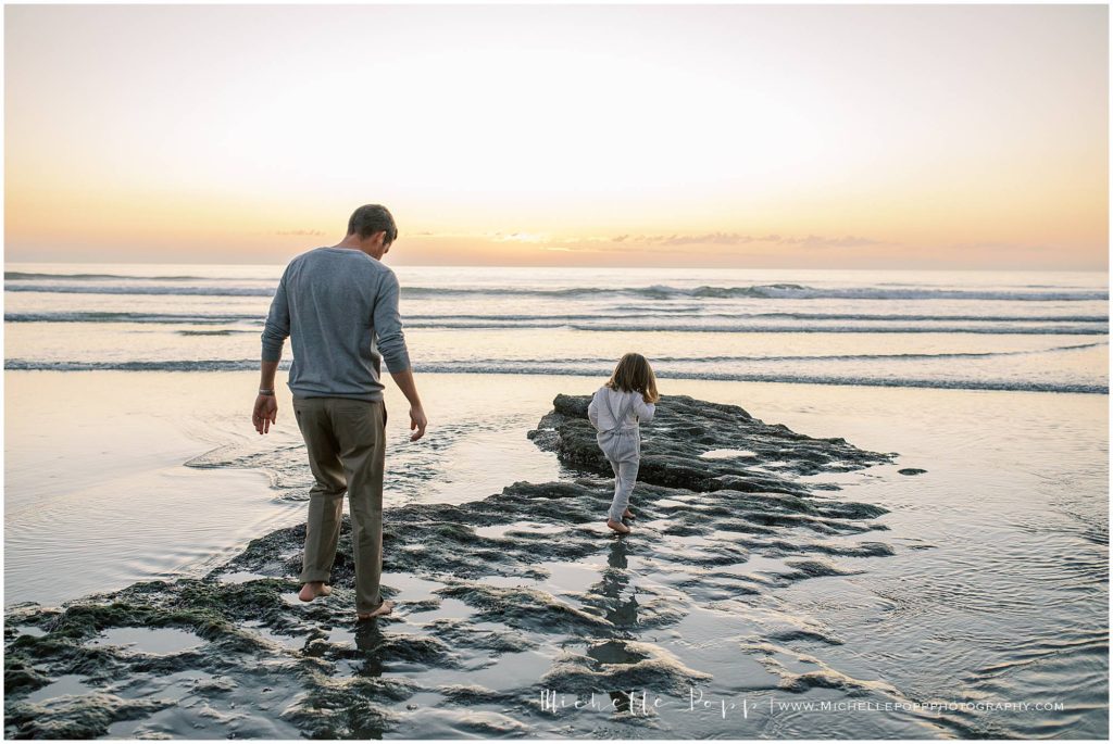 dad and son exploring during North County Beach Family Photos