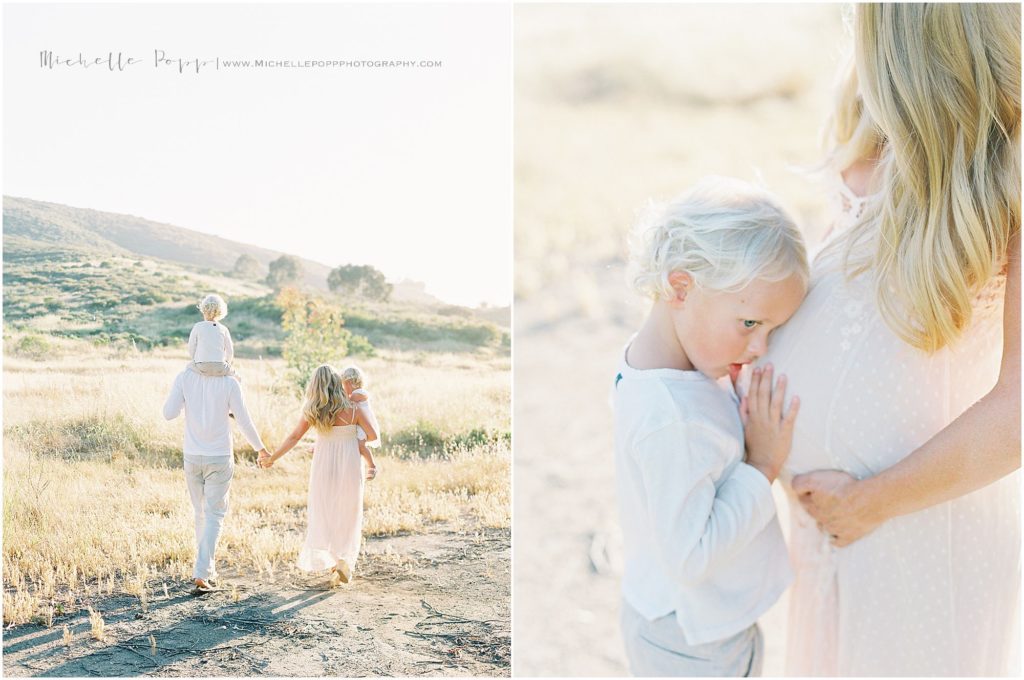 family holding hands walking away in a field