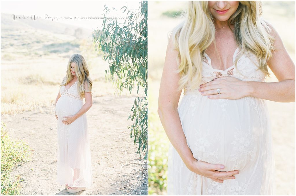 mom smiling down at her baby bump 