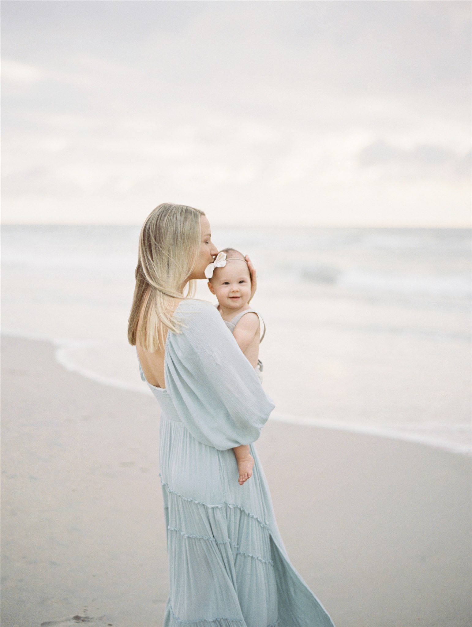 mom kissing baby on Wirghtsville Beach